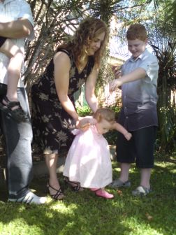 Casey participating in the naming of his little sister