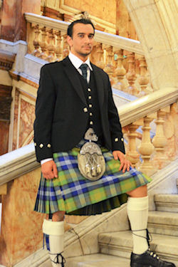 Azeem_Ibrahim wearing the Scottish-Islamic
                  tartan.