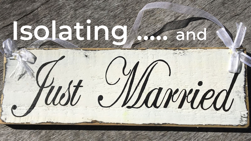 Rustic Just Married Sign on weathered grey
                        wood surface