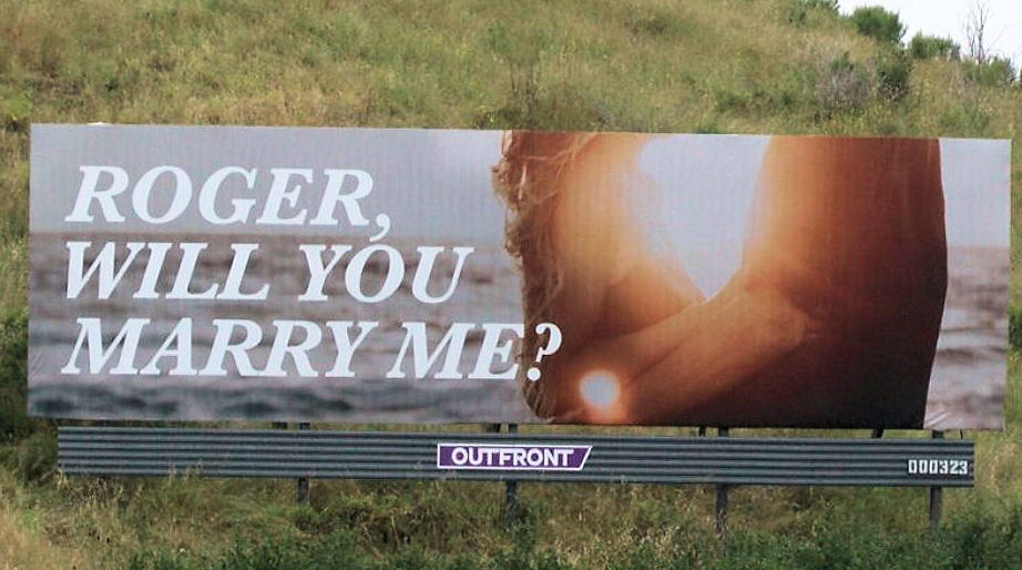 Billboard saying Roger, will you marry
                      me>
