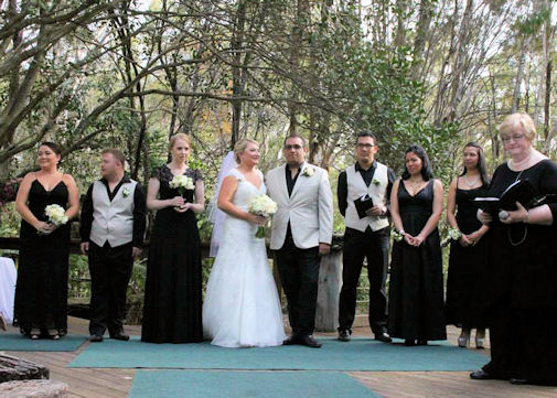 Jennifer Cram Marriage
                      Celebrant with wedding party - black and white
                      theme