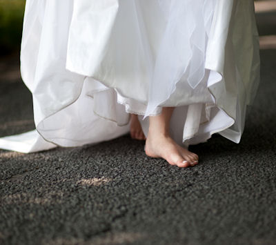 bride in wedding dress with bare feet