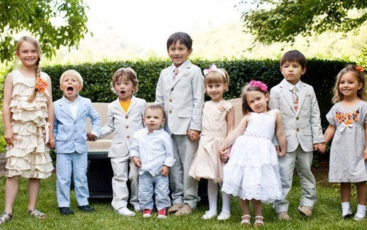 Group of children of assorted ages dressed in
                    their best