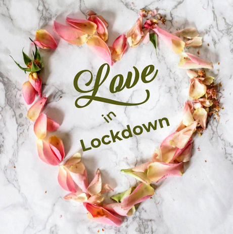 The words Love in Lockdown surrounded by
                        rose petals in the shape of a heart