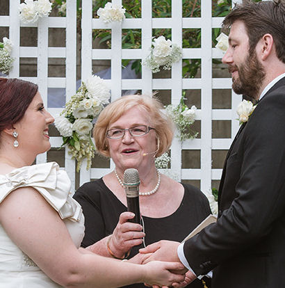 Jennifer Cram using both headset microphone
and handheld microphone for the vows
