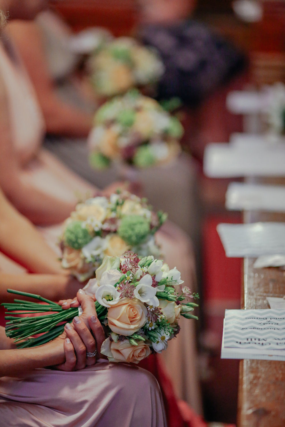 bridesmaids seated during ceremony