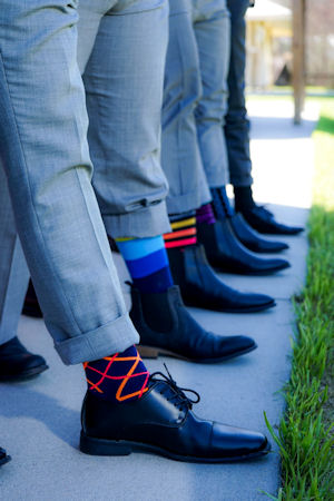 Feet and socks of
                        groom and other males