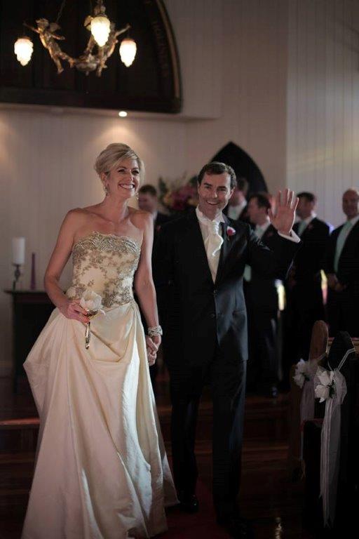 Katie & Lachie
                        walk back up the aisle after their 'white
                        wedding' renewal of vows at the Broadway Chapel